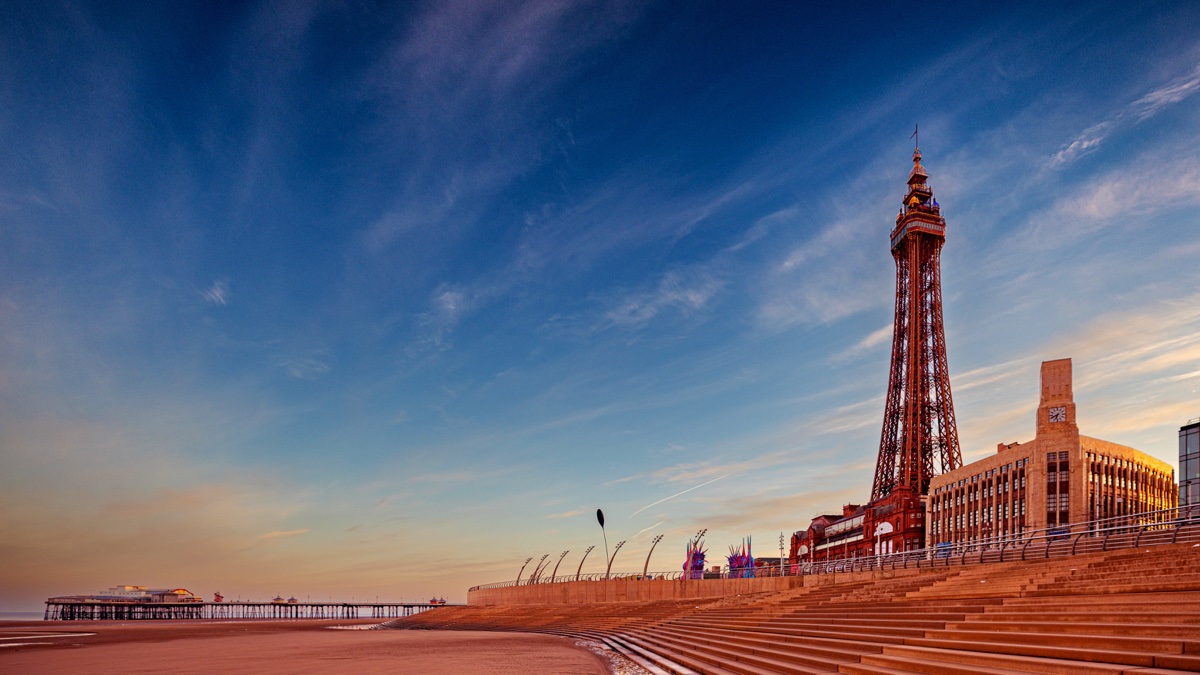 Blackpool Tower, promenade steps and beach at sunrise