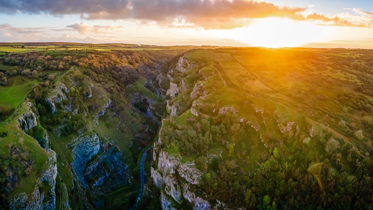 Aerial view of Cheddar Gorge winding through the Mendip Hills at sunset, Somerset
