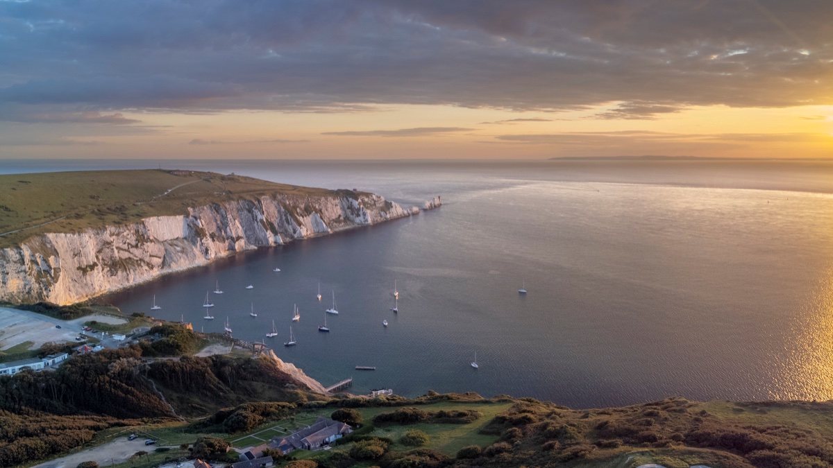 The Needles headland and lighthouse in autumn evening light from Headon Warren, Isle of Wight