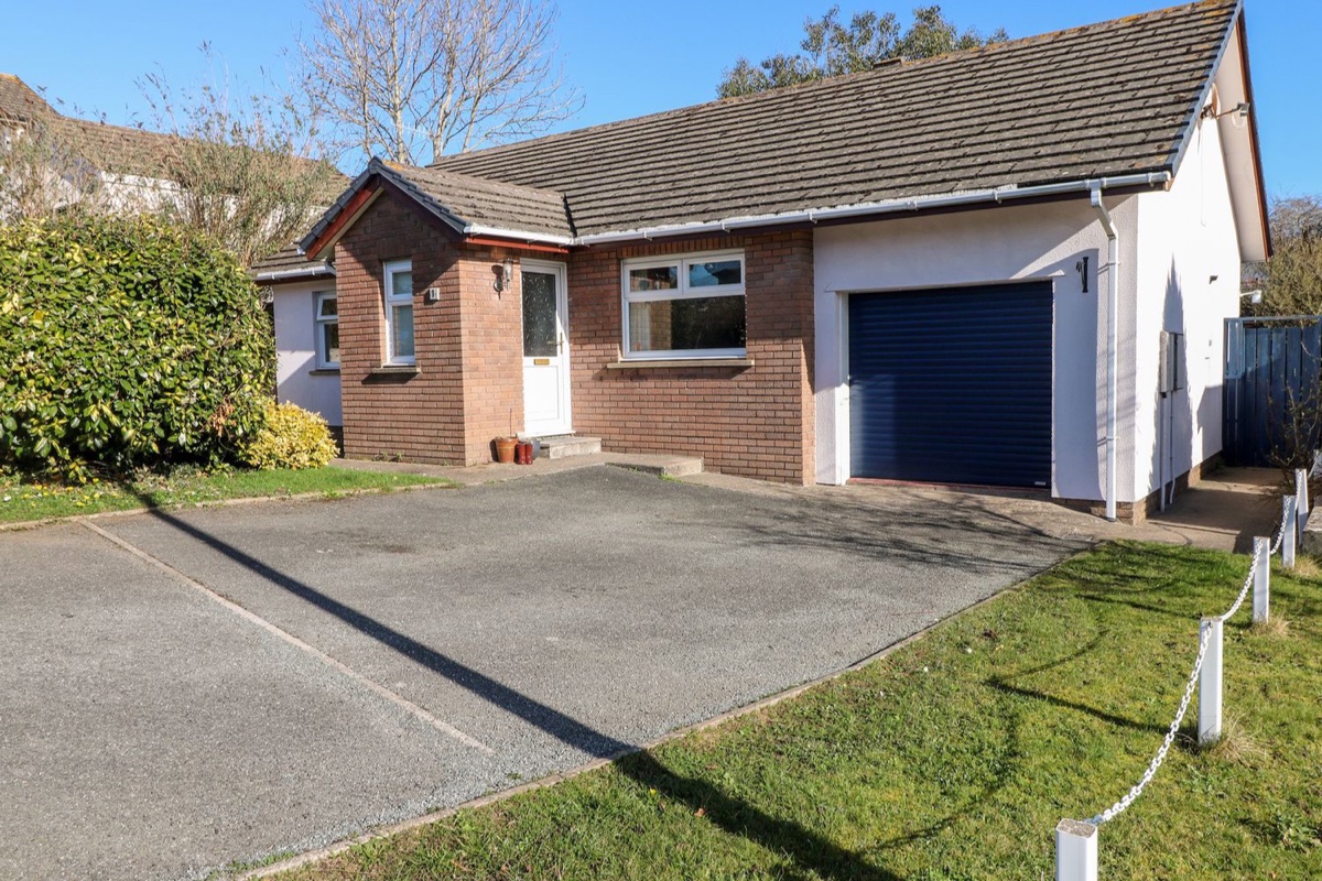 Brick bungalow exterior and driveway at 1 Gloucester Way