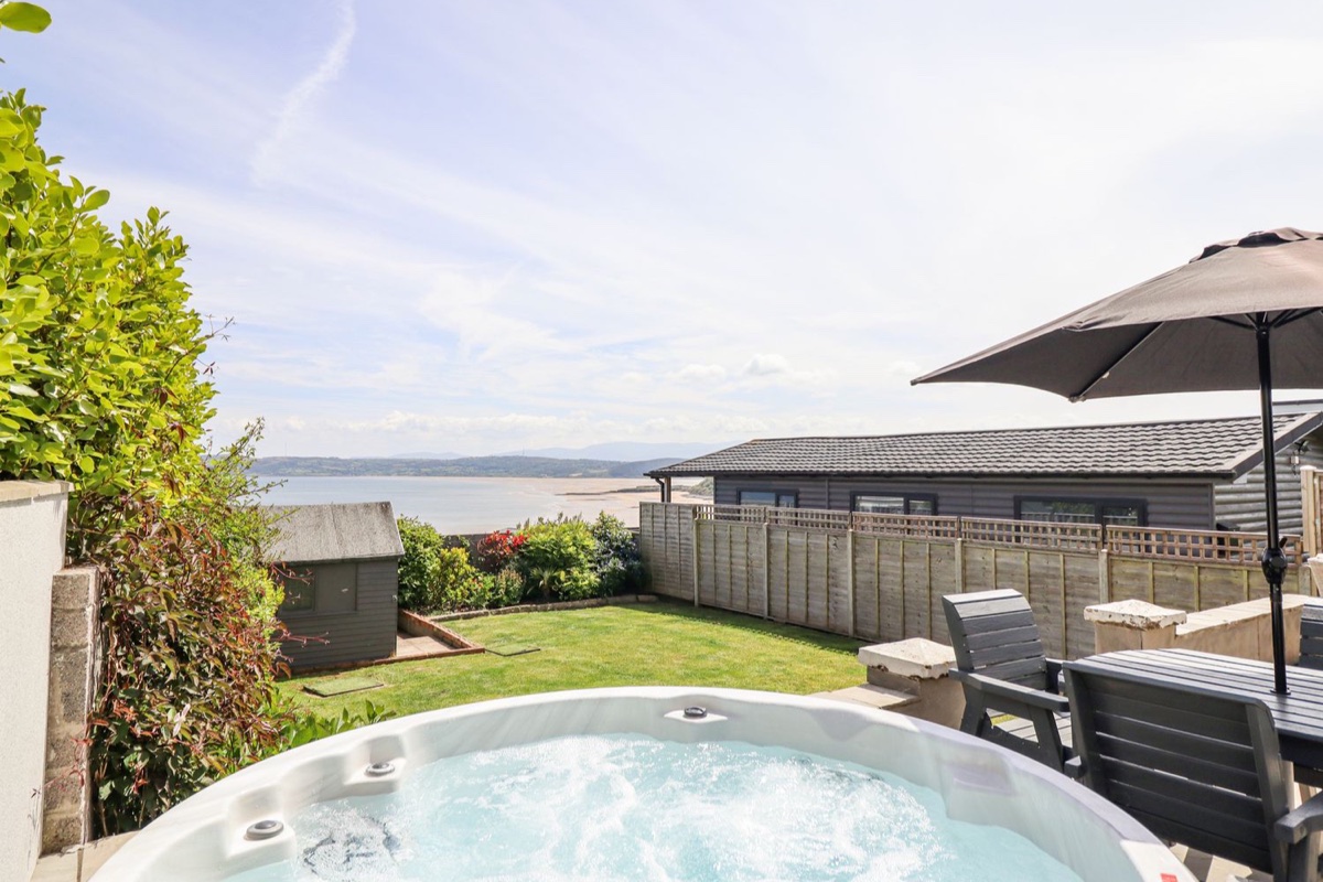 Bryn Mor garden hot tub with sea views at Benllech
