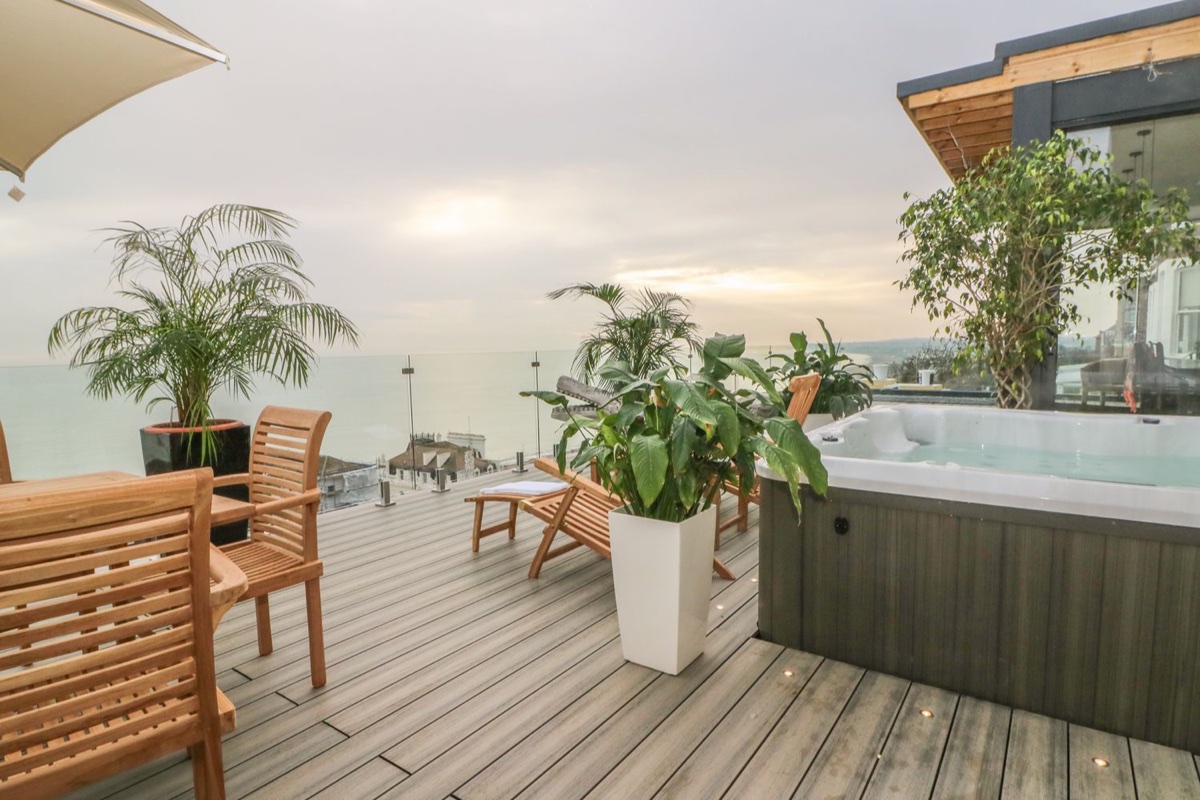 Decked terrace with a hot tub and far-reaching sea views at Cliffhanger near Hastings