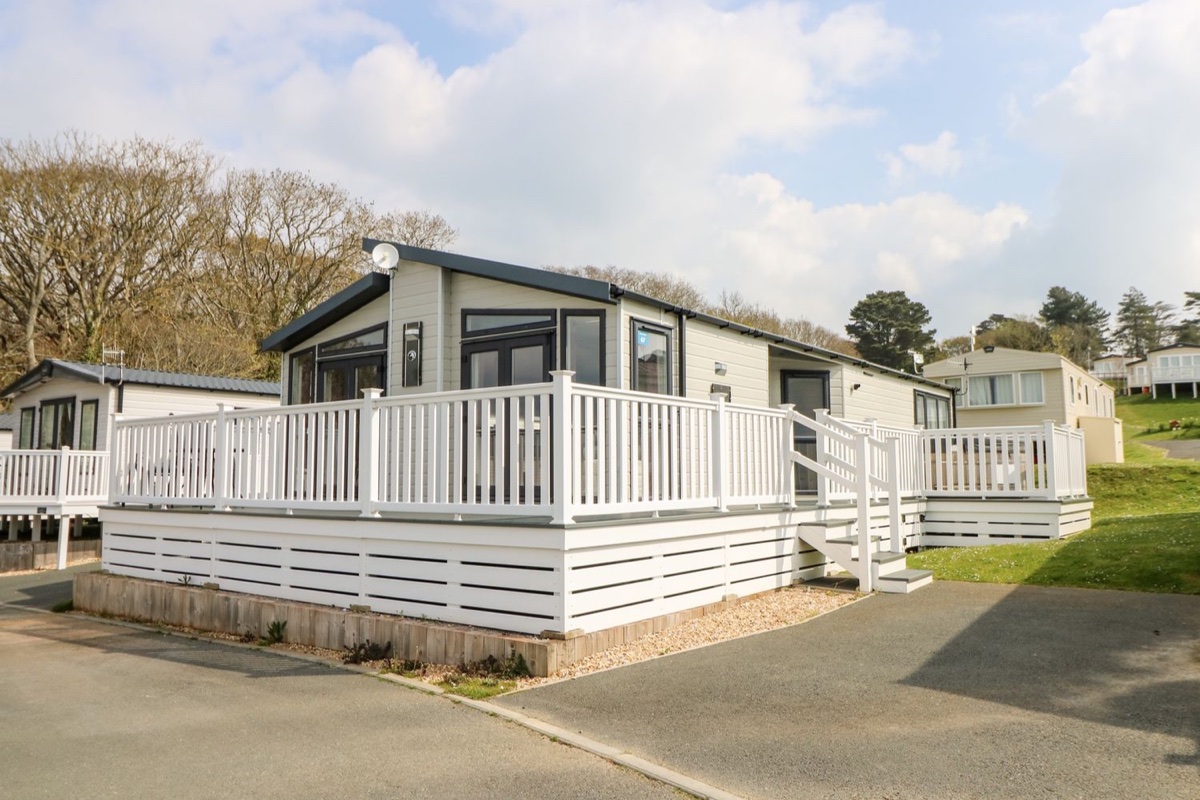 Crosswinds 67 lodge exterior with wraparound white decking