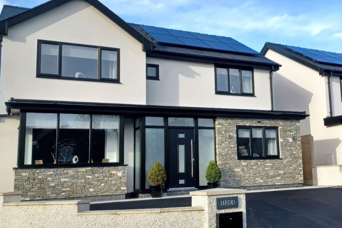 Hedd modern exterior with stone detail and solar panels