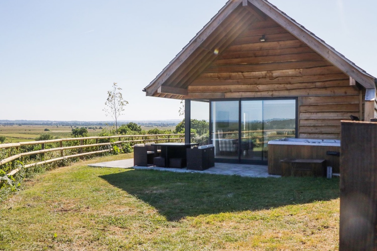 Heron Lodge Castle Farm timber lodge with outdoor seating