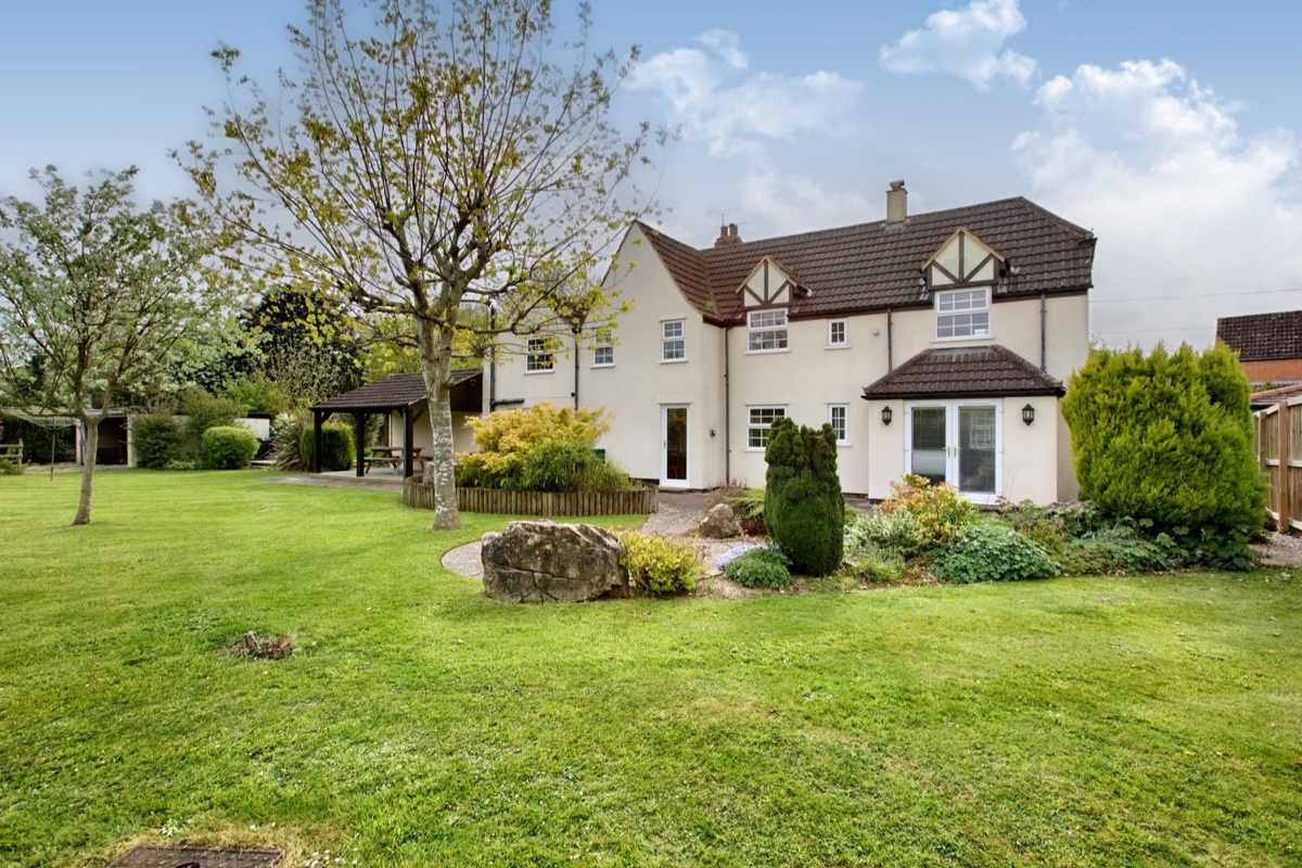 Ingleside rear garden exterior with lawn and patio doors
