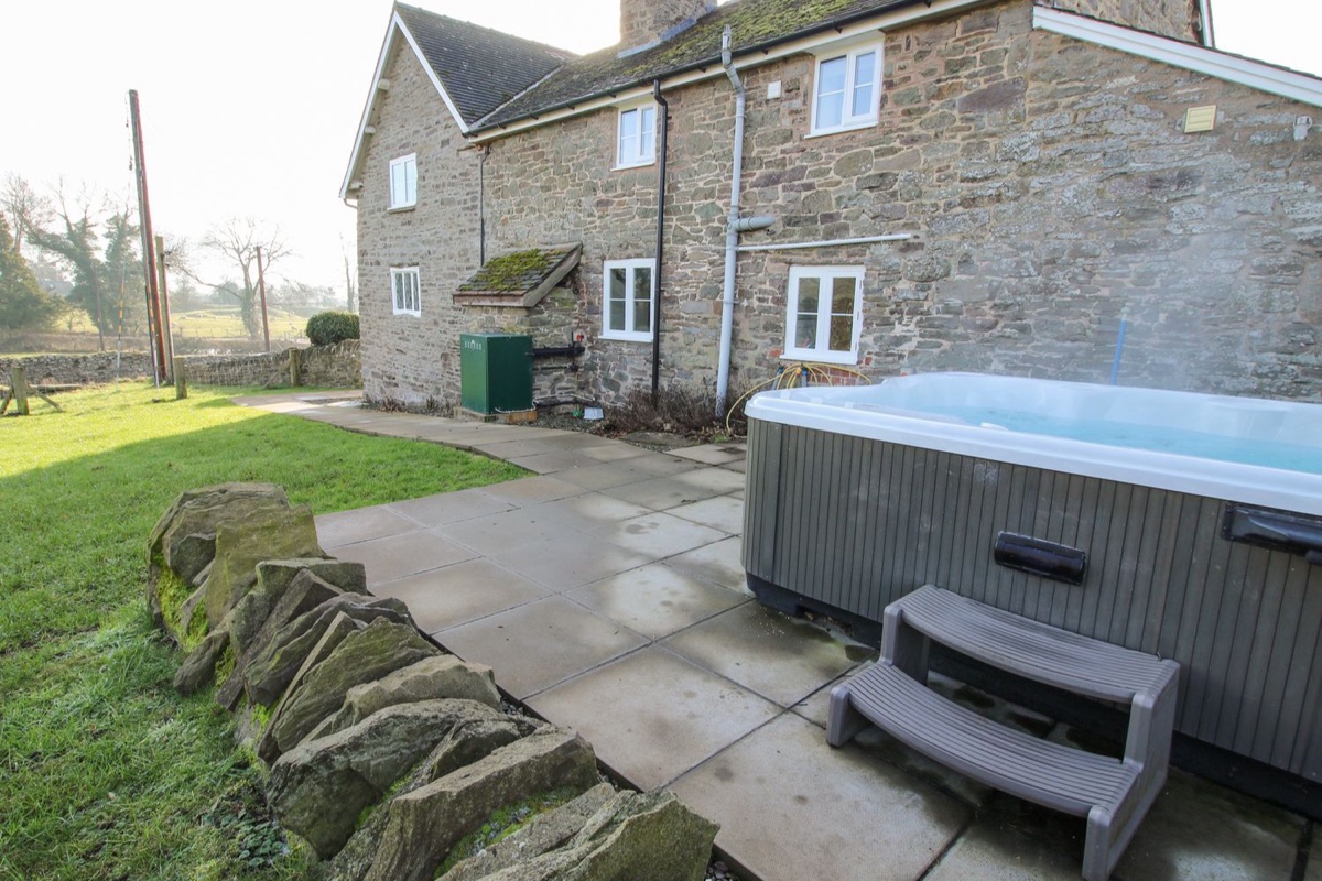 Little Bicton stone cottage with hot tub on the patio