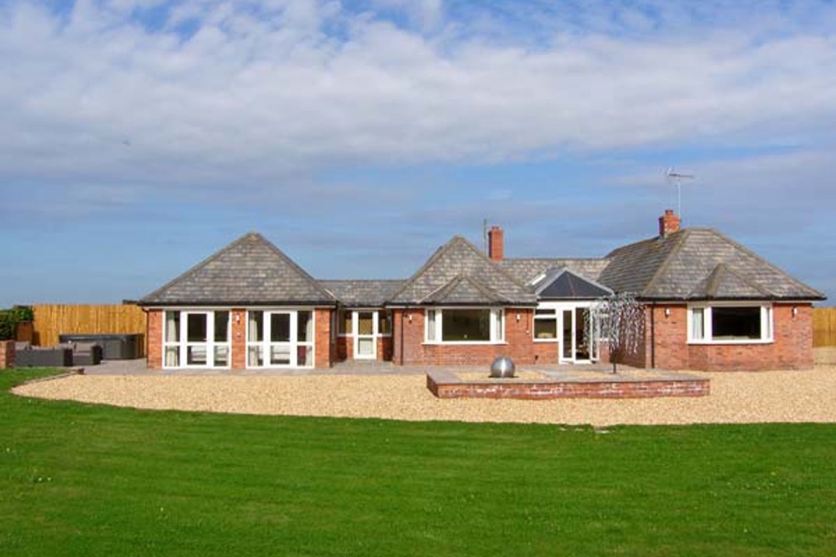 Lower Lodge exterior and lawn in the Shropshire countryside