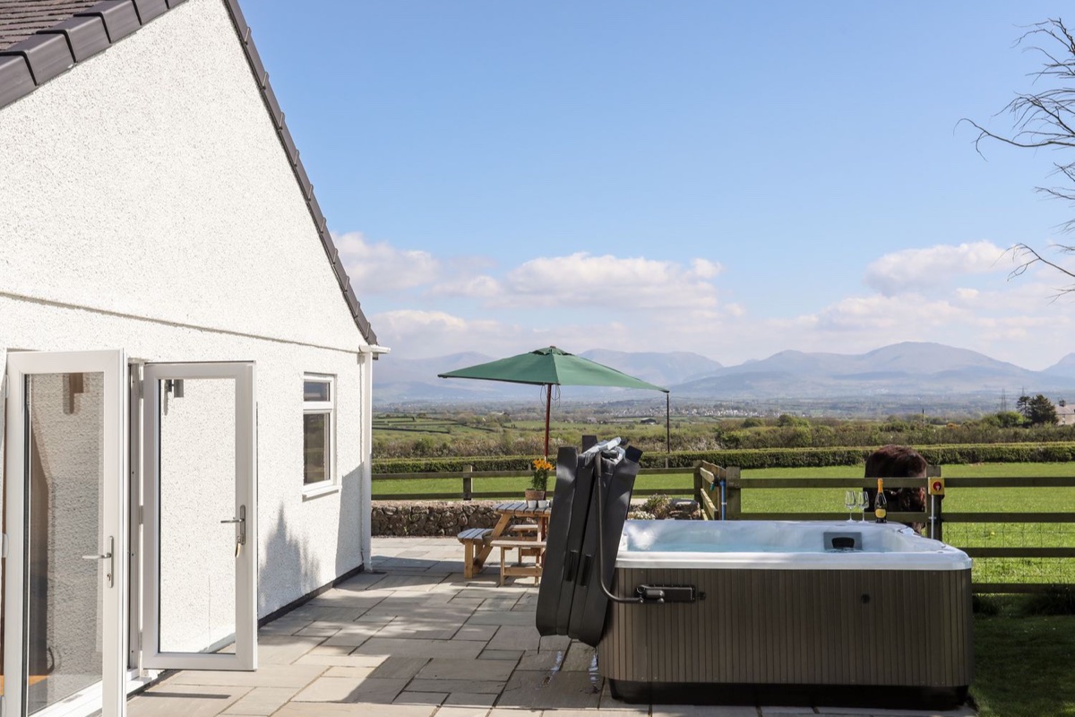 Mynydd Mwyn hot tub patio with mountain views