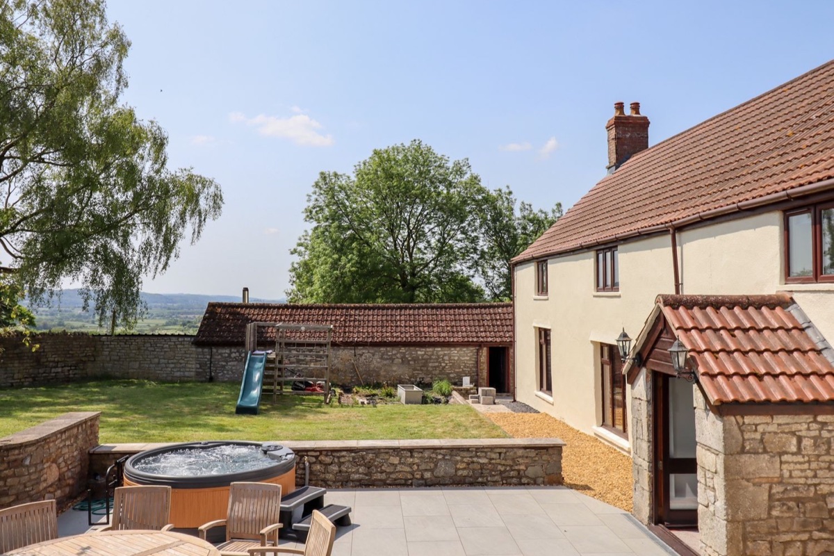 Nempnett Farmhouse patio with hot tub and garden play slide