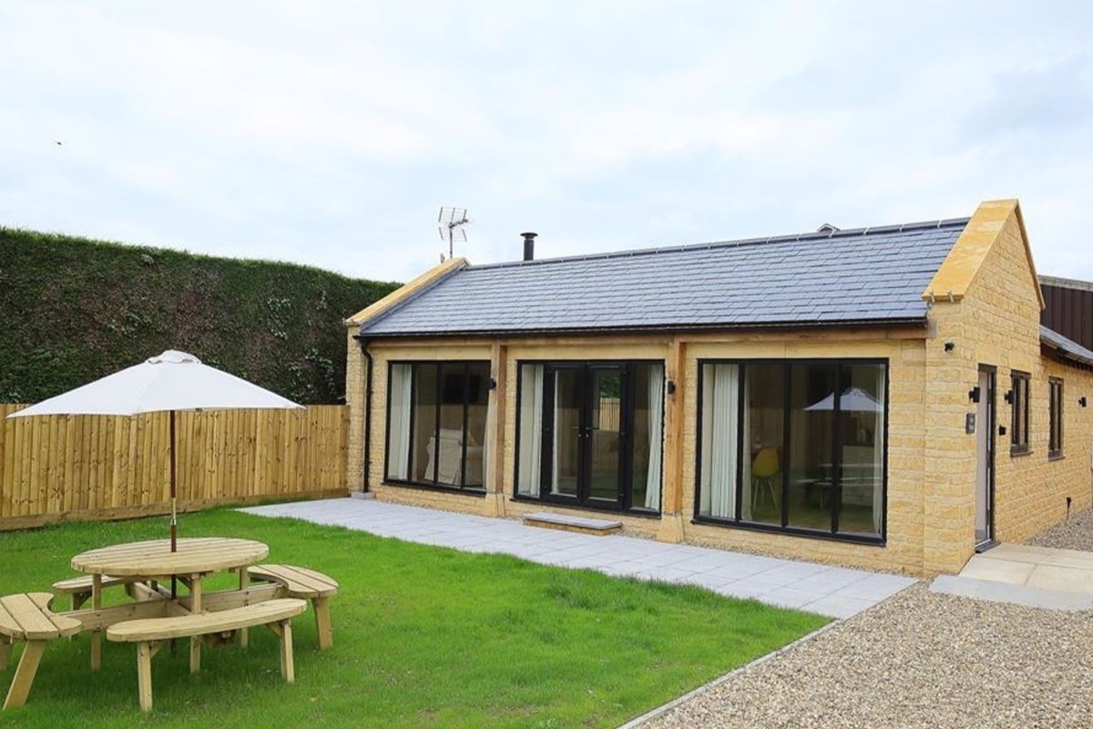 Park Bothy cottage exterior with lawn and patio doors