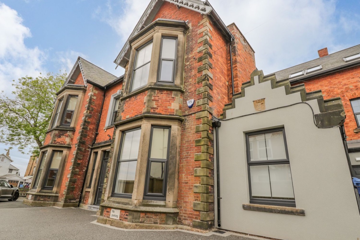 Railway House red-brick frontage with bay windows in Scarborough