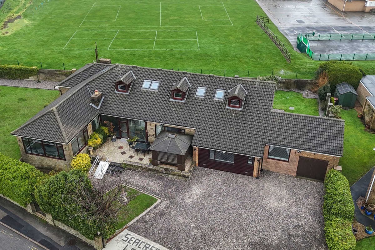 Seacrest Lodge aerial view showing the lodge, driveway and playing fields
