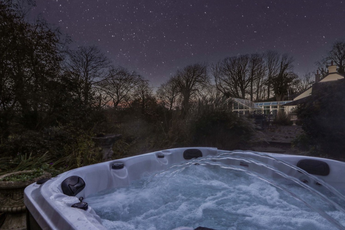 St Dogwells Barn hot tub under a starry night sky near Wolfscastle