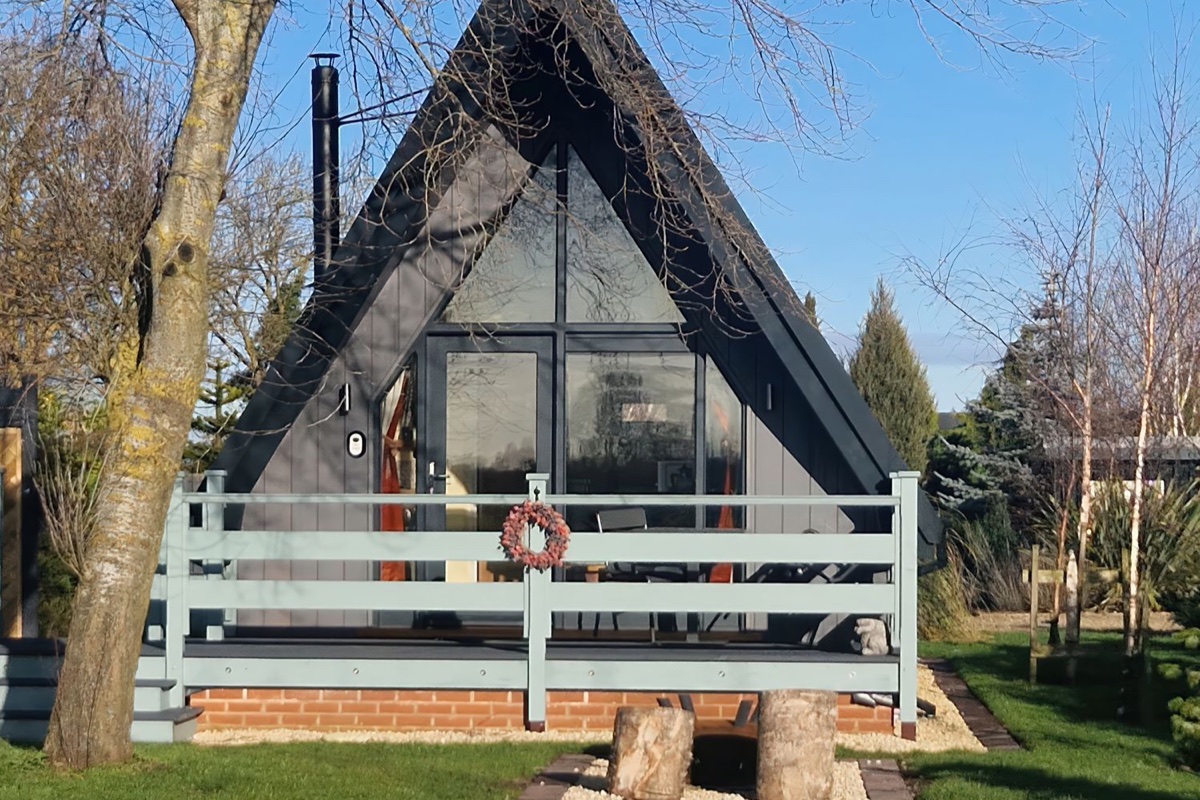 Sunflower Lodge A-frame exterior with deck and lawn