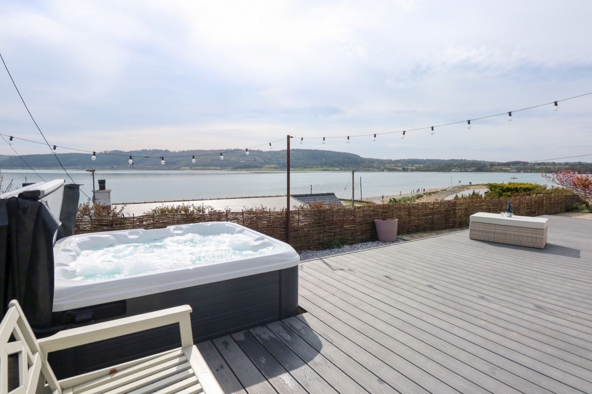 Swn Y Wylan hot tub deck overlooking Red Wharf Bay