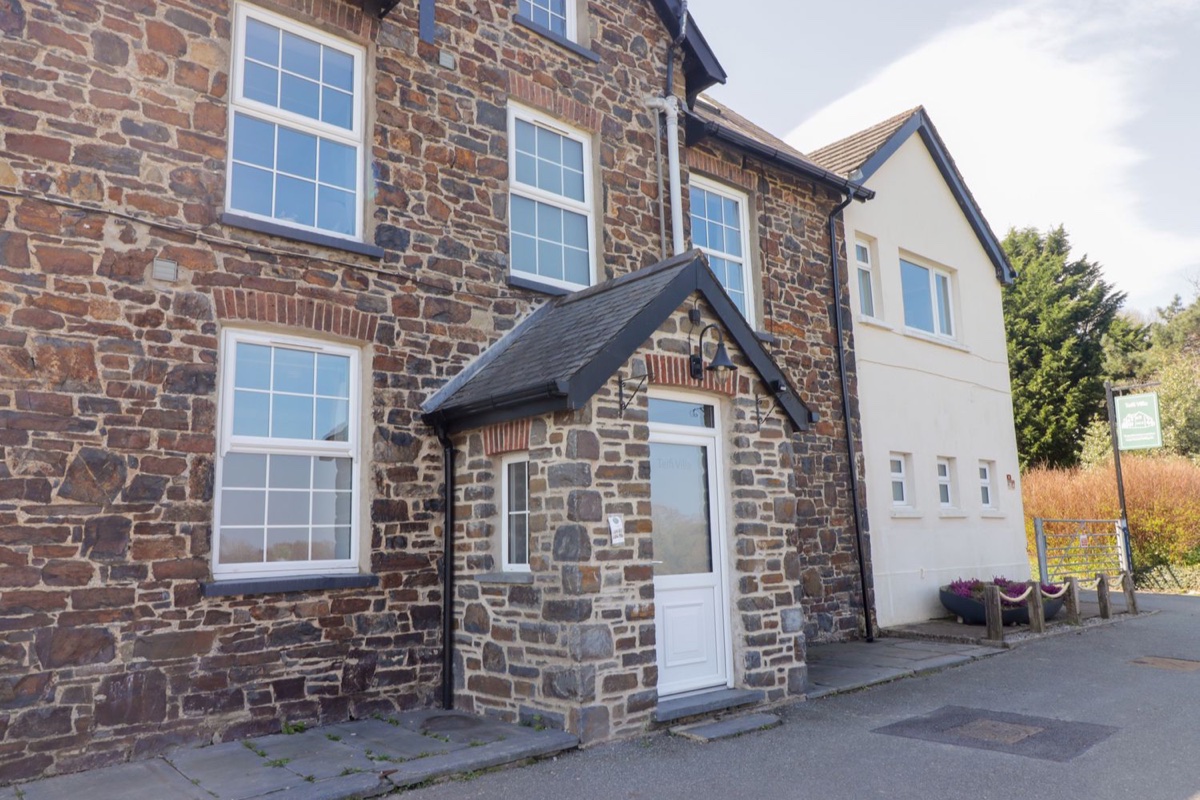 Stone and white frontage of Teifi Villa in St Dogmaels with a slate porch