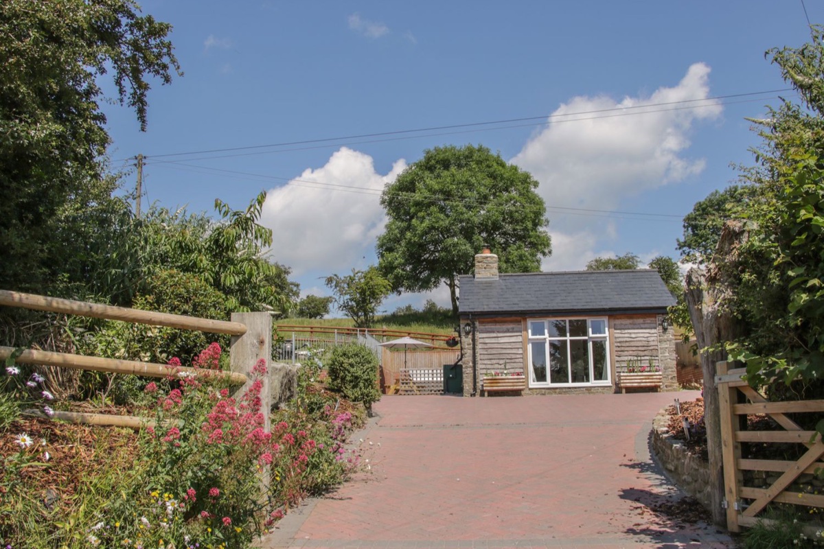 Approach to The Boundary Annex across the paved courtyard