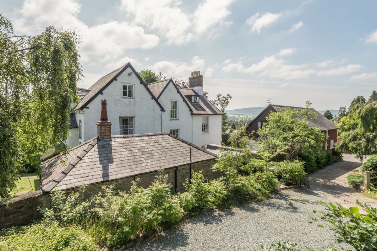 The Old Schoolhouse and Cottage exterior with valley views beyond