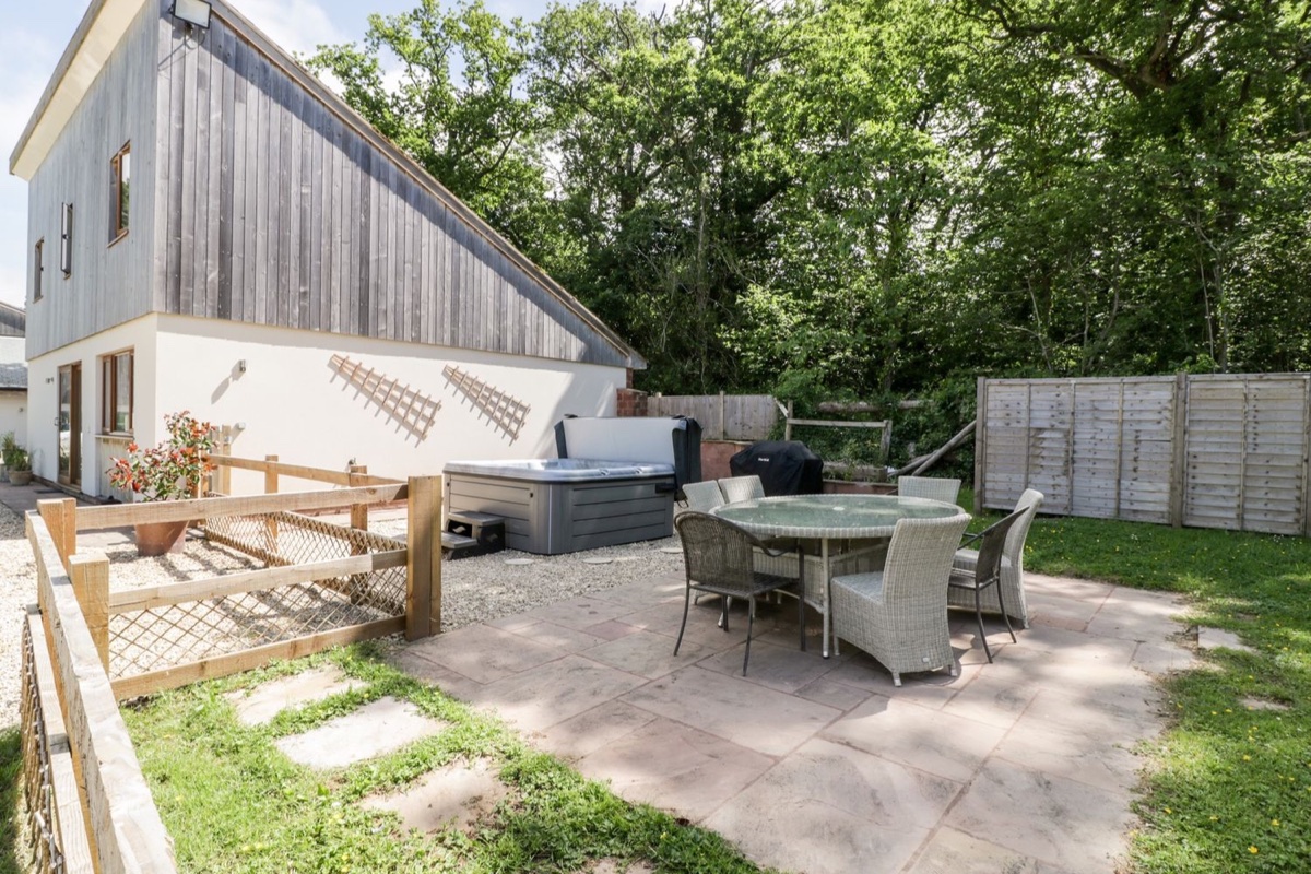The Outlook patio with outdoor dining beside the house